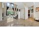 Open foyer with soaring ceilings, tile floors, staircase, and sliding glass doors to backyard at 2523 Jasmine Trace Dr, Kissimmee, FL 34758