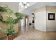 Spacious foyer with soaring ceilings, gleaming tile floors, and an open staircase to the second floor at 2523 Jasmine Trace Dr, Kissimmee, FL 34758