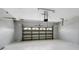 Garage interior showing the door and opening mechanism at 2523 Jasmine Trace Dr, Kissimmee, FL 34758