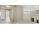 Upstairs hallway with white railing and access to multiple rooms, including bedrooms and bathrooms at 2523 Jasmine Trace Dr, Kissimmee, FL 34758