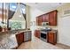 Open kitchen with stainless steel appliances, granite countertops, and lots of natural light at 2523 Jasmine Trace Dr, Kissimmee, FL 34758