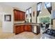 Open kitchen featuring wooden cabinets, stainless steel appliances, and granite countertops at 2523 Jasmine Trace Dr, Kissimmee, FL 34758
