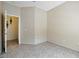 Empty room with tiled floors and a door opening at 2523 Jasmine Trace Dr, Kissimmee, FL 34758