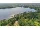 An aerial view of a community on a lake with lush green trees along the shoreline at 50989 Highway 27 # 179, Davenport, FL 33897