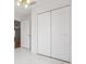 Bedroom with closet featuring panel doors and stylish tile flooring at 50989 Highway 27 # 179, Davenport, FL 33897