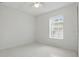 Bright bedroom with one window, a ceiling fan, and sleek tile flooring at 50989 Highway 27 # 179, Davenport, FL 33897