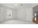 Bedroom with tile flooring, white walls, and windows for ample natural light at 50989 Highway 27 # 179, Davenport, FL 33897