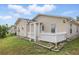Cozy single-story home featuring a well-maintained lawn, white picket fence and neutral toned siding at 50989 Highway 27 # 179, Davenport, FL 33897