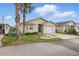 Charming single-story home with neutral siding, front yard, and attached garage at 50989 Highway 27 # 179, Davenport, FL 33897