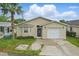 Charming single-story home with neutral siding, front yard, and attached garage at 50989 Highway 27 # 179, Davenport, FL 33897