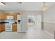 Bright eat-in kitchen with modern appliances and sliding door to backyard at 50989 Highway 27 # 179, Davenport, FL 33897