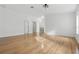 Open living area boasts neutral walls, light hardwood floors, and several entryways at 50989 Highway 27 # 179, Davenport, FL 33897