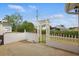 Enclosed patio area with a white fence and gate for outdoor relaxation and privacy at 50989 Highway 27 # 179, Davenport, FL 33897