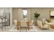 Bright dining space featuring modern table set and living area with neutral tones, inviting atmosphere at 1313 Hammock Reserve Dr, Deland, FL 32720