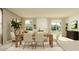 Open concept dining area with neutral tones, abundant natural light, and cozy decor at 1313 Hammock Reserve Dr, Deland, FL 32720