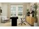 Stylish home office featuring a modern desk, comfortable seating, and ample natural light at 1313 Hammock Reserve Dr, Deland, FL 32720