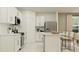 Bright, modern kitchen with stainless steel appliances, white cabinetry, and a convenient center island at 1313 Hammock Reserve Dr, Deland, FL 32720