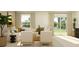 Bright and airy living area with modern seating arrangement and access to backyard at 1313 Hammock Reserve Dr, Deland, FL 32720