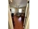 Cozy bedroom featuring wood floors, a ceiling fan, a sofa, and a comfortable seating area at 2807 Leicester Ter, The Villages, FL 32162