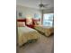 Inviting bedroom with twin beds, carpet flooring, and ample natural light at 2807 Leicester Ter, The Villages, FL 32162