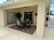Covered outdoor patio with ceiling fan and seating, perfect for relaxation and dining alfresco at 2807 Leicester Ter, The Villages, FL 32162