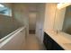 Modern bathroom featuring double sink vanity, walk-in shower and access to the walk-in closet at 3098 Voyager Ave, St Cloud, FL 34771