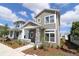 Charming two-story home with gray siding, stone accents, and a well-manicured front yard at 3098 Voyager Ave, St Cloud, FL 34771
