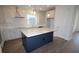 Modern kitchen features a large island, stainless steel appliances, and white cabinetry at 3098 Voyager Ave, St Cloud, FL 34771