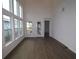 Bright living room with large windows and hardwood floors at 3098 Voyager Ave, St Cloud, FL 34771