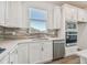 Bright kitchen featuring a quartz countertop, stainless steel appliances, and custom backsplash at 5807 Sw 87Th Ave, Ocala, FL 34481