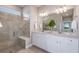 Modern bathroom with dual sinks, a walk-in shower, and a large mirror at 5832 Sw 87Th Ave, Ocala, FL 34481