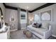 Cozy bedroom with comfortable seating, stylish decor, and soft natural light at 5832 Sw 87Th Ave, Ocala, FL 34481