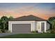 Charming single-story home featuring a two-car garage and a well-maintained lawn with landscaping at 5832 Sw 87Th Ave, Ocala, FL 34481