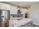 Modern kitchen featuring stainless steel appliances, a large island, and white cabinets at 5832 Sw 87Th Ave, Ocala, FL 34481