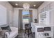Bright home office featuring a craft area and an elegant chandelier at 5832 Sw 87Th Ave, Ocala, FL 34481