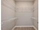 Spacious walk-in closet with ample shelving for organized storage at 5832 Sw 87Th Ave, Ocala, FL 34481