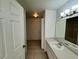 Bathroom vanity featuring modern fixtures, tile floor, and ample lighting at 13103 Mulberry Park Dr # 833, Orlando, FL 32821