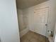 Standard bathtub and toilet with tile flooring and a door leading to the hallway at 13103 Mulberry Park Dr # 833, Orlando, FL 32821