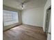 A bedroom featuring wood floors and a window with lots of light at 13103 Mulberry Park Dr # 833, Orlando, FL 32821