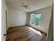 A bedroom featuring wood floors and a window with lots of light at 13103 Mulberry Park Dr # 833, Orlando, FL 32821