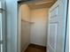 Walk-in closet featuring modern vinyl flooring and a wire shelving unit at 13103 Mulberry Park Dr # 833, Orlando, FL 32821