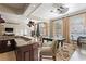Spacious clubhouse area with pool table, kitchen bar, and multiple ceiling fans at 13103 Mulberry Park Dr # 833, Orlando, FL 32821