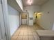 Laundry room with neutral tile flooring and a washer and dryer at 13103 Mulberry Park Dr # 833, Orlando, FL 32821