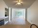 Open living room featuring ceiling fans and wood flooring throughout at 13103 Mulberry Park Dr # 833, Orlando, FL 32821