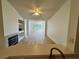 Spacious living room with wood floors, a fireplace, and lots of natural light at 13103 Mulberry Park Dr # 833, Orlando, FL 32821