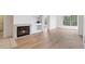 Bright living room with fireplace and wood flooring at 13103 Mulberry Park Dr # 833, Orlando, FL 32821