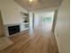 Bright living room with wood floors and fireplace at 13103 Mulberry Park Dr # 833, Orlando, FL 32821