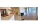 Open floor plan featuring kitchen, living area with fireplace, and dining space at 13103 Mulberry Park Dr # 833, Orlando, FL 32821