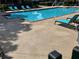 Inviting swimming pool surrounded by lounge chairs, perfect for relaxation and enjoying sunny days at 13103 Mulberry Park Dr # 833, Orlando, FL 32821