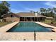 Beautiful backyard features an in-ground pool and brick patio for outdoor living at 1275 Man O War Dr, Deland, FL 32724